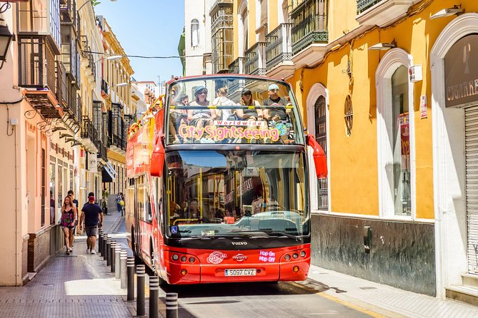 City Sightseeing Seville Hop-On Hop-Off Bus Tour - Stop 1 to Stop 5: river views, Plaza de España, and Maria Luisa Park
