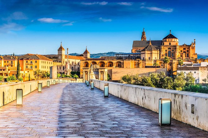 Cordoba Highlights: Guided Day Tour from Seville - Crossing Córdoba’s Roman Bridge