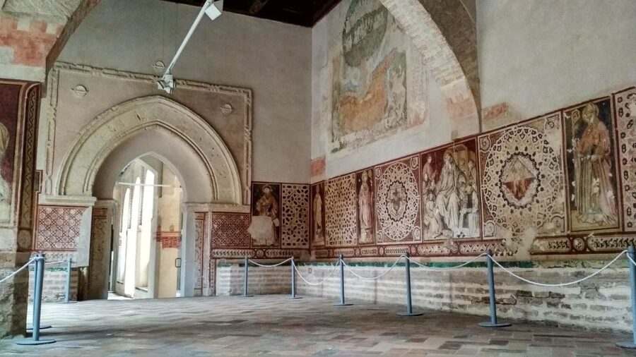 From Seville: Italica Roman City & Medieval Monastery Tour - Roman streets, houses, and mosaic floors