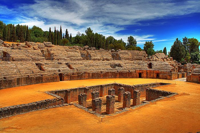 From Seville: Italica Roman City Tour - Entering the 25,000-seat amphitheater