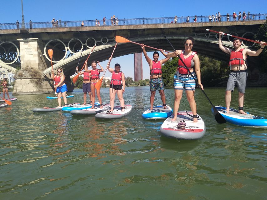 Seville: 2 Hour Paddle Surf Class - Passing beneath Triana Bridge