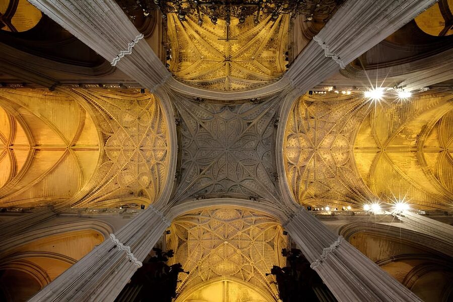 Seville: Cathedral of Seville Guided Night Tour & Light Show - Entering Seville Cathedral after sunset