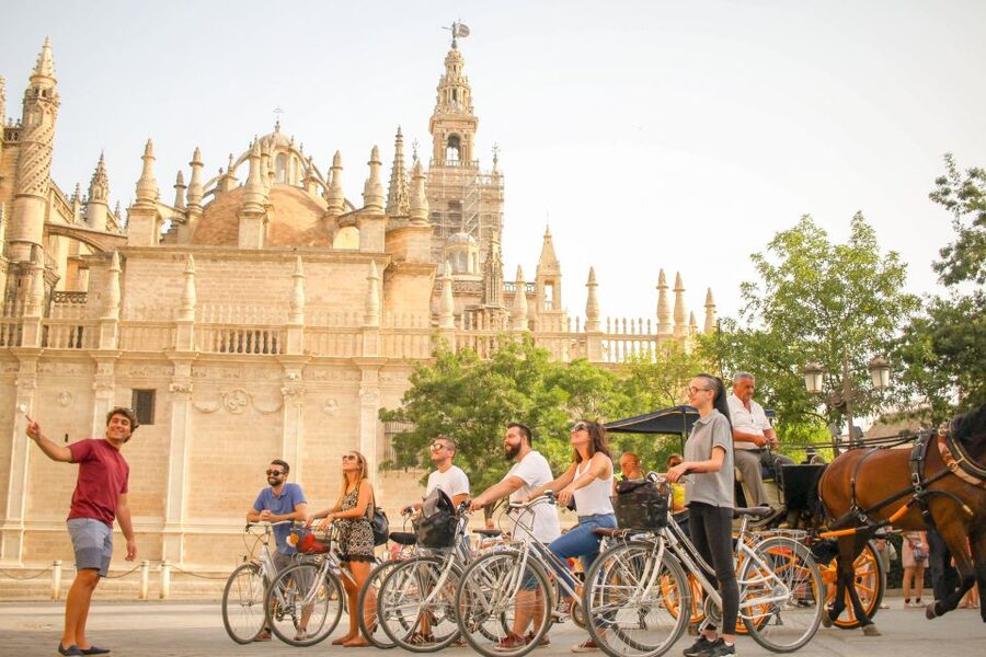Seville: City Sightseeing and Local Culture Bike Tour - Crossing into Triana