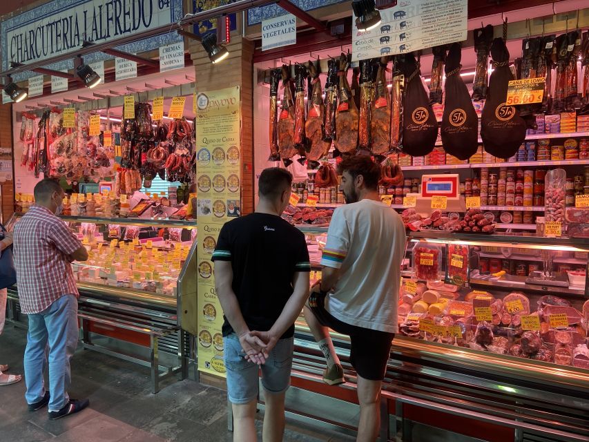 Seville: Flavors of Andalucía Guided Food Tour with Tastings - Crossing the river into Triana