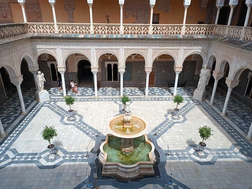 Seville: Guided visit of the Casa de Pilatos with entrance tickets - Courtyards, tiles, and the lower floor