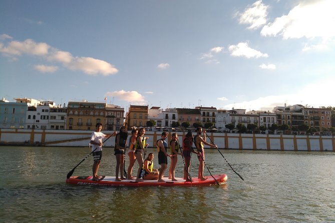 Seville: Paddle Surf on an XXL Board - Puente de San Telmo and the modern Torre Sevilla