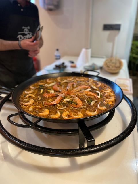 Seville: Paella and Sangria Experience - Watching paella come together in Seville