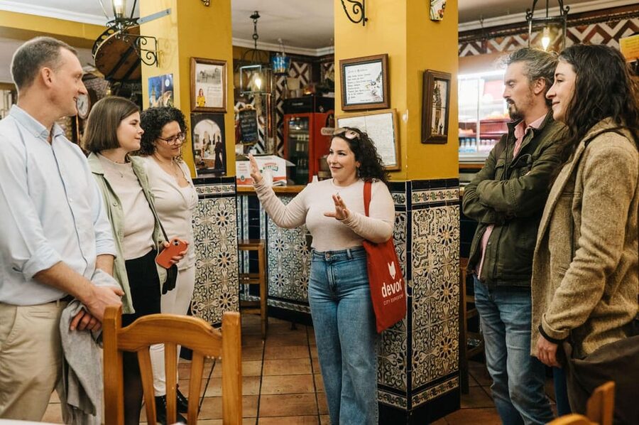 Seville: Private Tapas & History Tour in Triana Neighborhood - Crossing into Triana from Seville’s old center