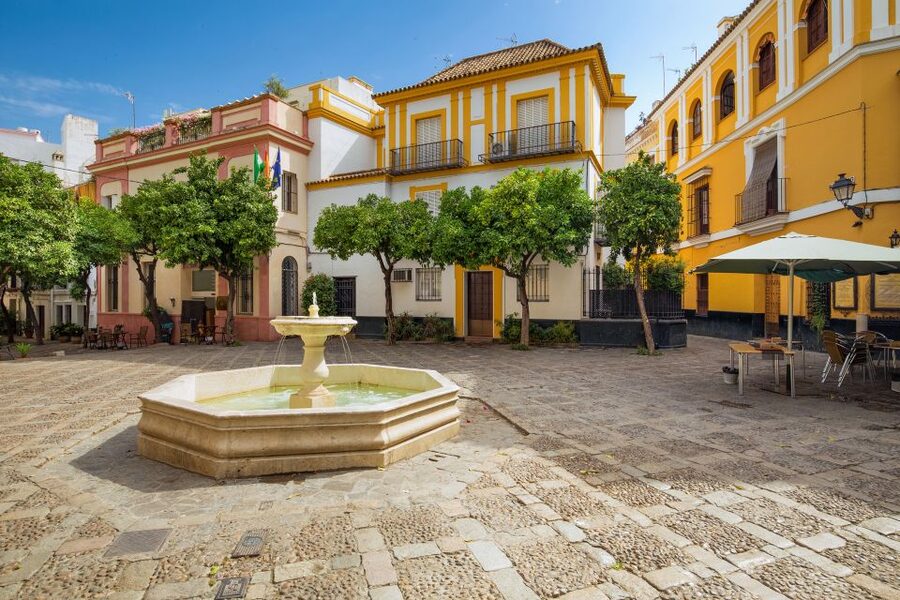 Seville: Relaxing City Bike Tour with a Tour Guide - Murillo Gardens and the former tobacco factory