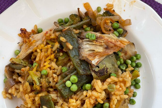 Seville: Rooftop Paella Showcooking and Sangría - The paella lesson is useful, but the pace may vary