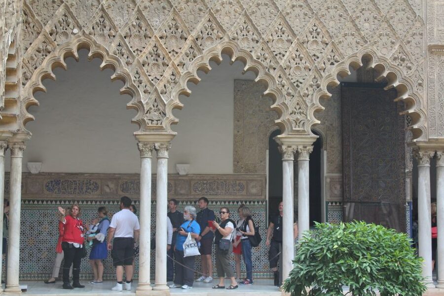 Seville: Royal Alcazar, Cathedral and Giralda Tower Tour - The Royal Alcázar and an hour of layered design