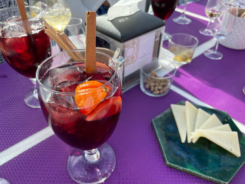 Seville: Sangria Tasting Experience - Manchego and olives keep the glasses company