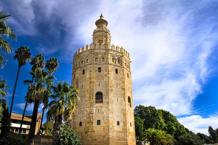 Seville: Small-Group City Highlights Walking Tour - Torre del Oro beside the river