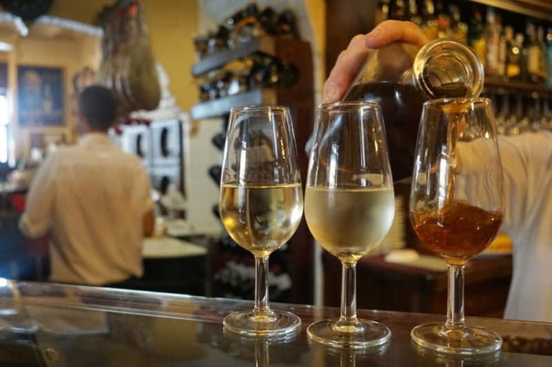 Seville: Tapas Walking Tour with Traditional Flamenco Show - Maestro Marcelino: cured meats, drinks, and the rules of tapas
