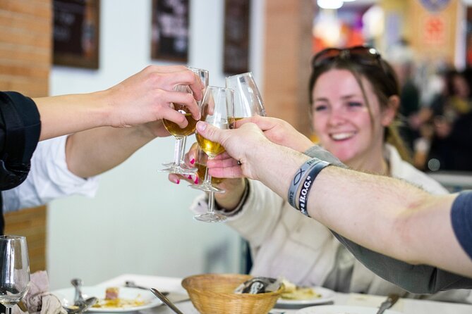 Seville: Triana Market Tapas Tour - Group size, language, and accessibility