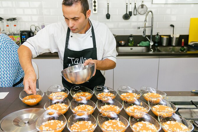 Spanish Cooking Class & Triana Market Tour in Sevilla - Cooking paella with the chef’s guidance